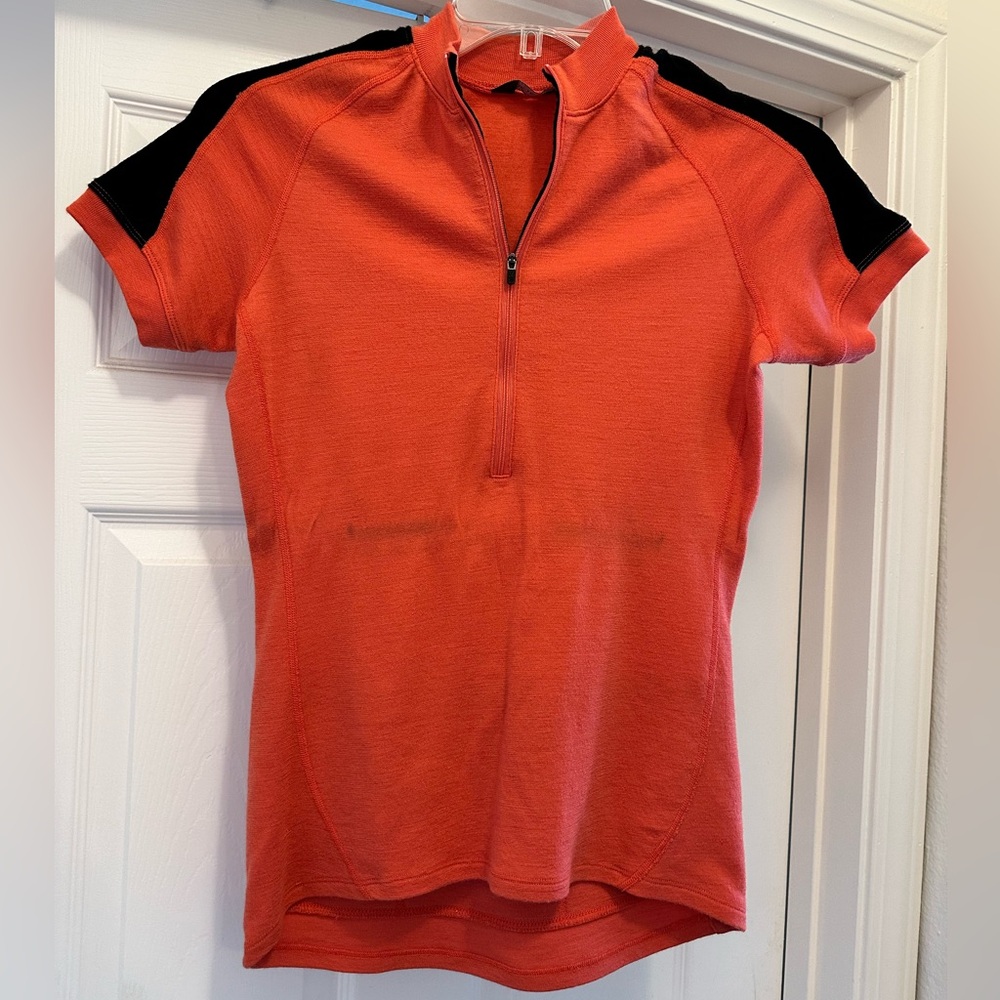 Ibex women’s orange wool cycling jersey, medium